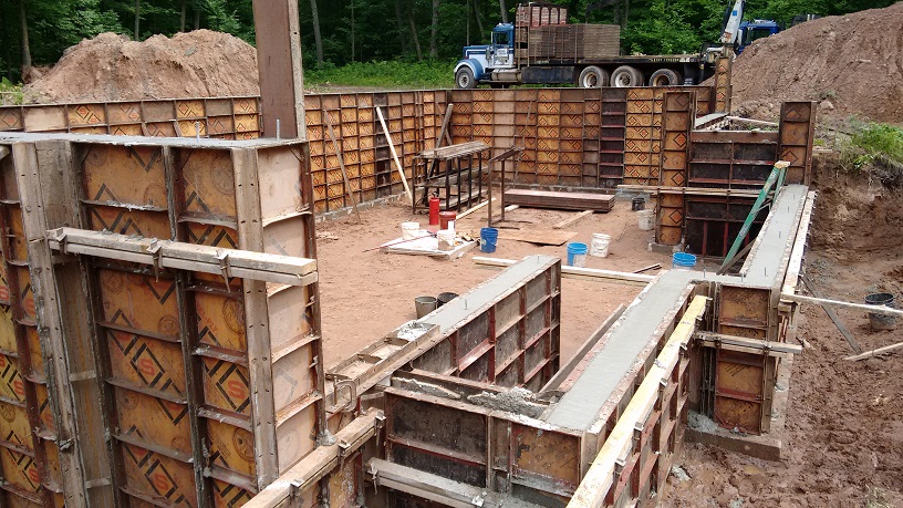 picture of
      basement wall forms, full of concrete